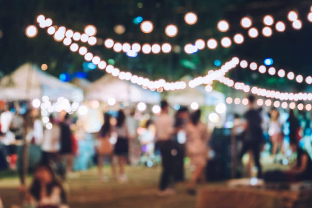 Festival Event Party with Hipster People Blurred Background