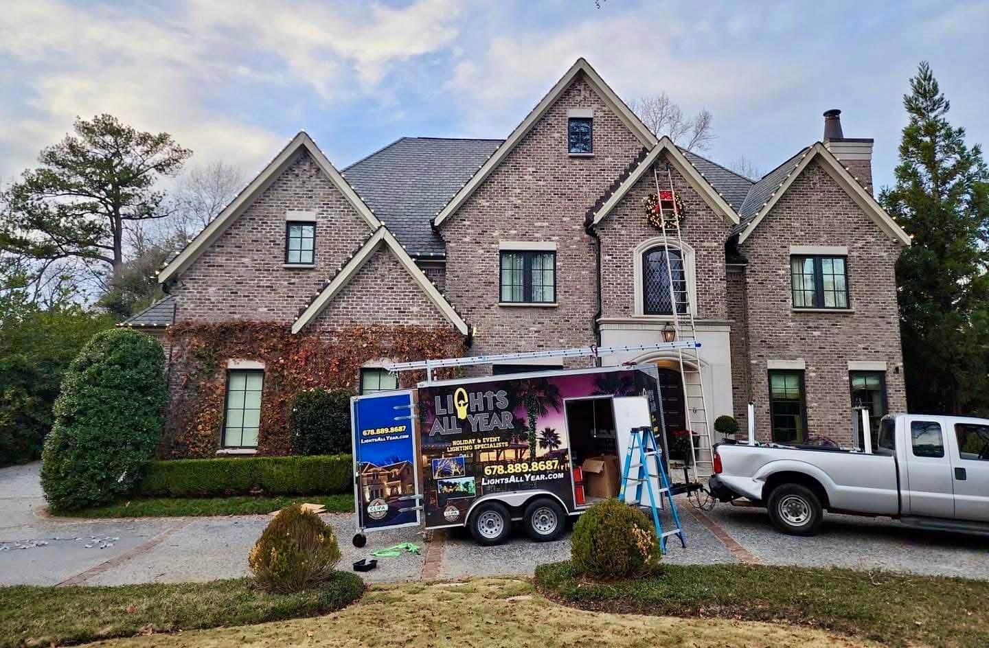 lights all year service truck in front of house